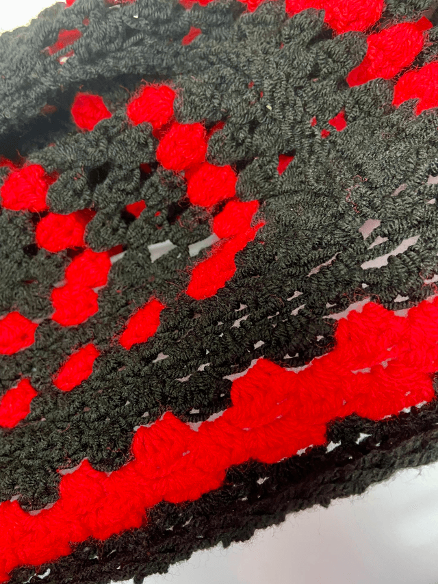 Red and black shrug cardigan.