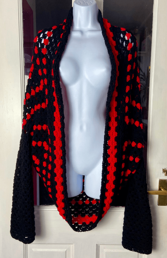Red and black shrug cardigan.