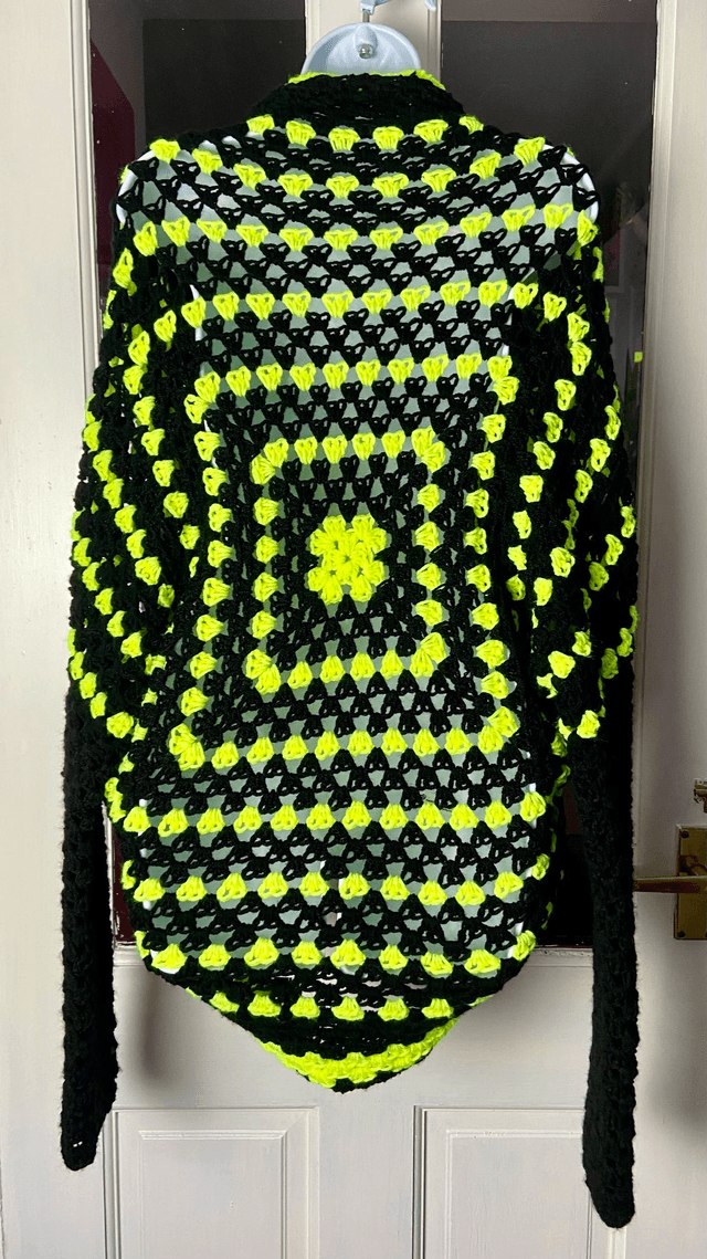 Yellow and black shrug style cardigan.