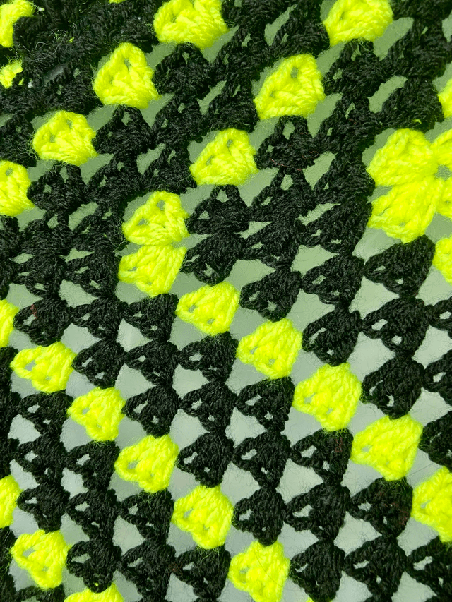 Yellow and black shrug style cardigan.