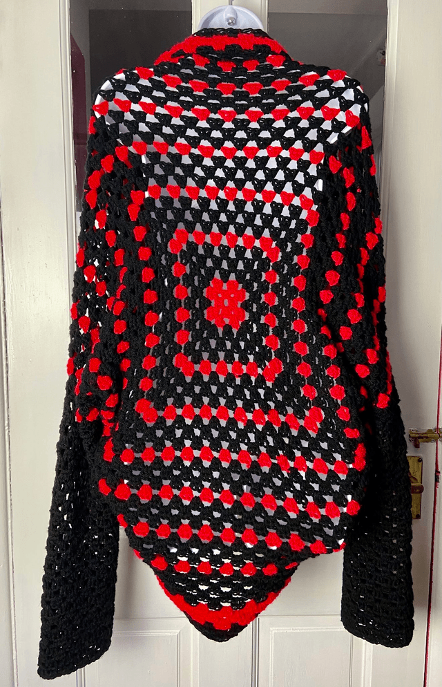 Red and black shrug cardigan.