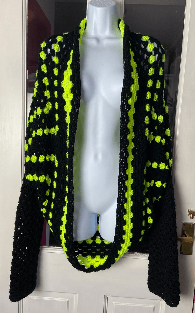 Yellow and black shrug style cardigan.