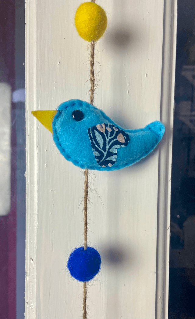 Hanging blue bird decoration.