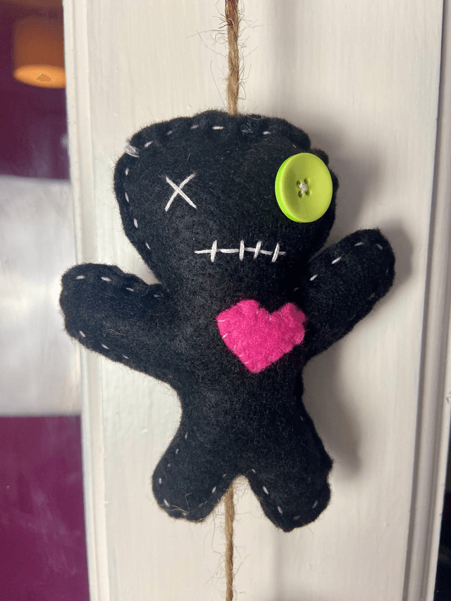 Hanging voodoo doll decoration.