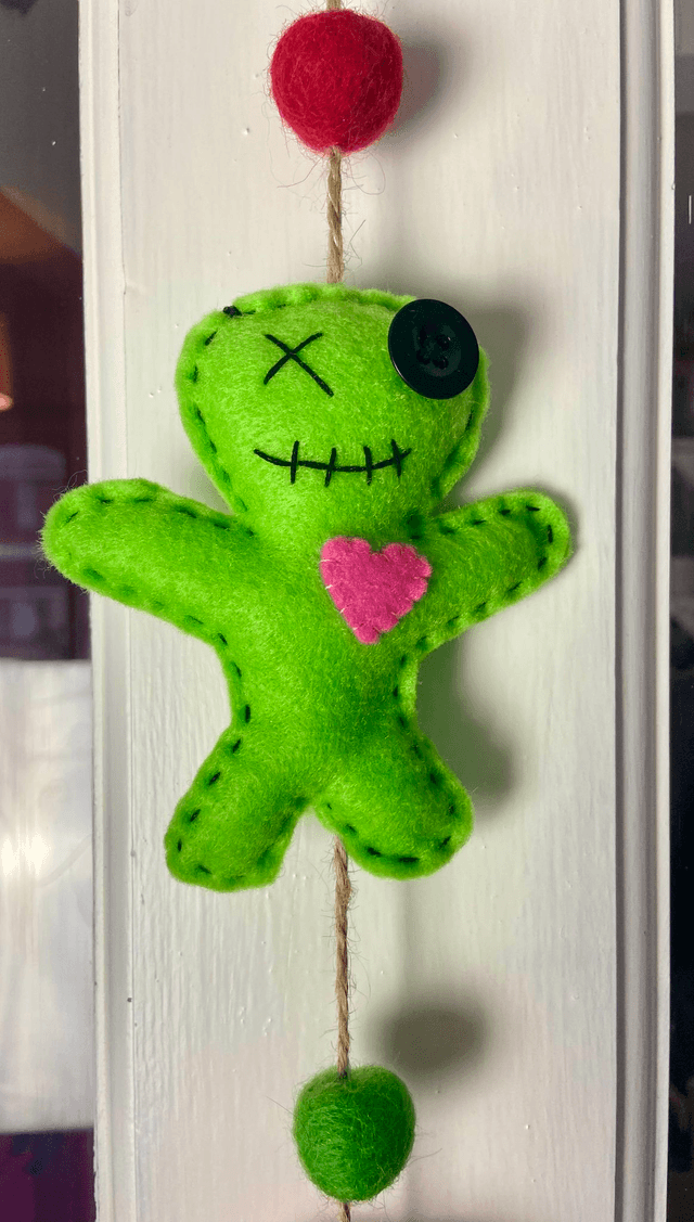 Hanging voodoo doll decoration.