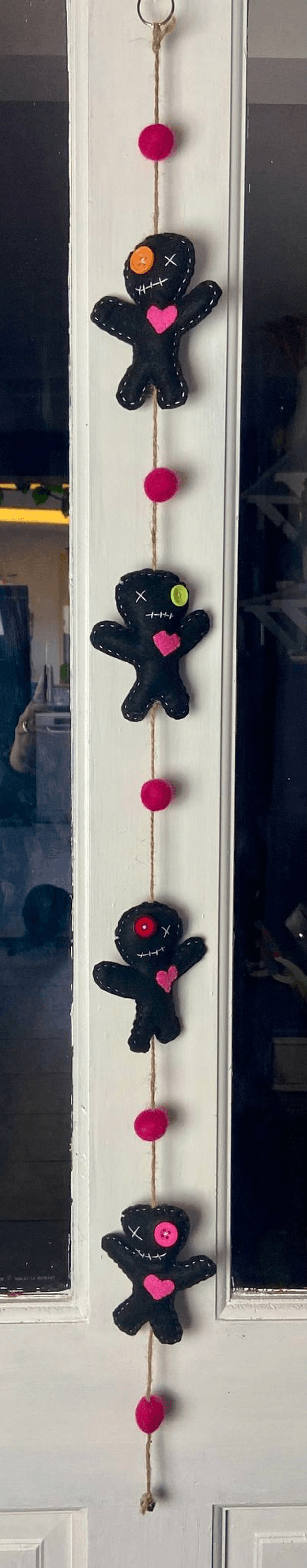 Hanging voodoo doll decoration.